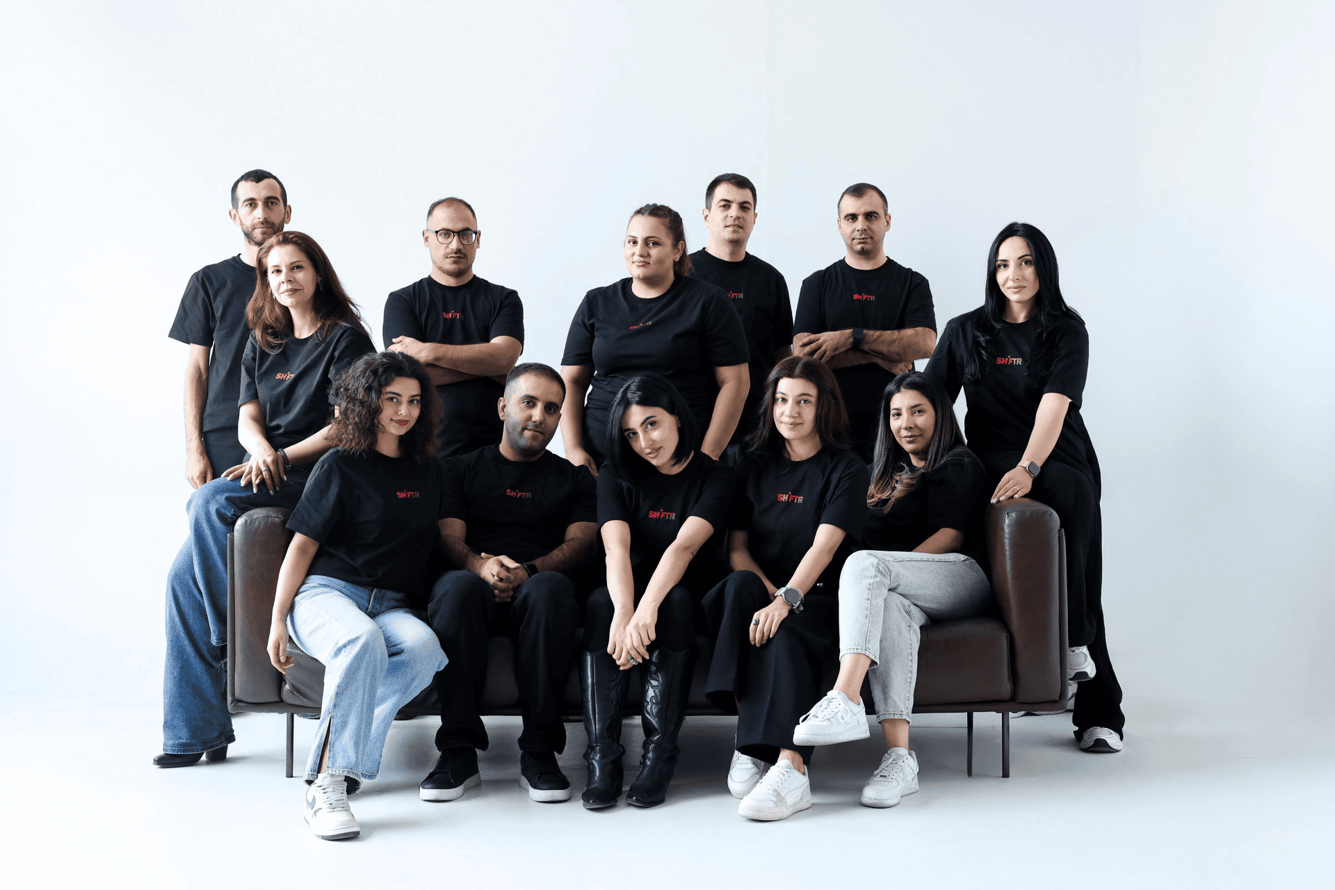 Shiftr team gathered together in branded shirts